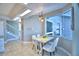 Bright breakfast nook features a small table and chairs, offering water views at 2119 Kirkland Lake Dr, Auburndale, FL 33823
