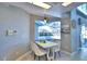 Eat-in kitchen nook boasts a charming table, chairs, and pool views at 2119 Kirkland Lake Dr, Auburndale, FL 33823
