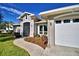 House exterior with a two-car garage and manicured landscaping at 2119 Kirkland Lake Dr, Auburndale, FL 33823