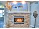 Modern linear fireplace with stone surround and water views at 2119 Kirkland Lake Dr, Auburndale, FL 33823