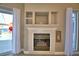 Gas fireplace with built-in shelving at 2119 Kirkland Lake Dr, Auburndale, FL 33823