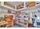 Organized garage with overhead storage and workbench at 2119 Kirkland Lake Dr, Auburndale, FL 33823