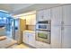 Modern kitchen with stainless steel appliances and island at 2119 Kirkland Lake Dr, Auburndale, FL 33823
