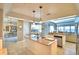Open concept kitchen with granite island and water view at 2119 Kirkland Lake Dr, Auburndale, FL 33823