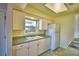 Kitchen with white cabinets and double sink at 2119 Kirkland Lake Dr, Auburndale, FL 33823