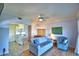 Living room with view into kitchen and seating area at 2119 Kirkland Lake Dr, Auburndale, FL 33823