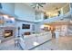 High-ceiling living room features a fireplace, open concept, and water views at 2119 Kirkland Lake Dr, Auburndale, FL 33823