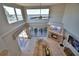 Living room with vaulted ceilings, water views, and fireplace at 2119 Kirkland Lake Dr, Auburndale, FL 33823