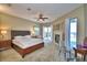 Spacious main bedroom with fireplace, water views, and sitting area at 2119 Kirkland Lake Dr, Auburndale, FL 33823