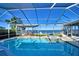 Inviting screened pool with spa and lake view at 2119 Kirkland Lake Dr, Auburndale, FL 33823