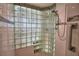 Modern shower with glass block wall and built-in seat at 2119 Kirkland Lake Dr, Auburndale, FL 33823