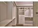 Bright walk-in closet with custom built-in shelving at 2119 Kirkland Lake Dr, Auburndale, FL 33823