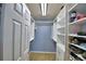 Spacious walk-in closet with ample shelving and hanging space at 2119 Kirkland Lake Dr, Auburndale, FL 33823