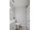 Clean bathroom with a shower/tub combo, white vanity, and updated flooring at 2500 21St Nw St # 22, Winter Haven, FL 33881