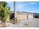 Tan double garage doors with walkway to entrance at 2500 21St Nw St # 22, Winter Haven, FL 33881