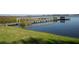 Serene lakefront view with wooden dock at 2500 21St Nw St # 22, Winter Haven, FL 33881