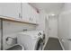 Convenient laundry room with washer, dryer, and extra storage at 2500 21St Nw St # 22, Winter Haven, FL 33881