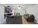 Bright living room with wood-look floors and comfy sofas at 2500 21St Nw St # 22, Winter Haven, FL 33881