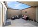 Private patio with seating area and dartboard at 2500 21St Nw St # 22, Winter Haven, FL 33881