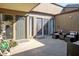 Private patio with seating area and sliding glass doors at 2500 21St Nw St # 22, Winter Haven, FL 33881