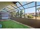 Relaxing screened porch with artificial turf and a swing at 2500 21St Nw St # 22, Winter Haven, FL 33881