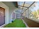Cozy screened porch with artificial turf and a swing at 2500 21St Nw St # 22, Winter Haven, FL 33881