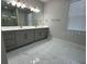 Modern bath with double vanity, ample cabinets, and large mirror at 2510 Lakefront Dr, Lake Wales, FL 33898