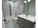 Bathroom featuring a tiled tub and shower, and modern fixtures at 2510 Lakefront Dr, Lake Wales, FL 33898