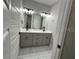 Bathroom features a double sink vanity with great lighting at 2510 Lakefront Dr, Lake Wales, FL 33898