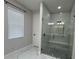 Bathroom featuring a walk-in shower with glass doors, and modern fixtures at 2510 Lakefront Dr, Lake Wales, FL 33898