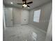 Bedroom featuring a ceiling fan, closet, and window at 2510 Lakefront Dr, Lake Wales, FL 33898