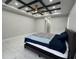 Spacious bedroom featuring tray ceilings and modern finishes at 2510 Lakefront Dr, Lake Wales, FL 33898
