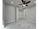 Neutral bedroom features a modern ceiling fan and closet with double doors at 2510 Lakefront Dr, Lake Wales, FL 33898