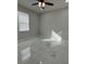Bright bedroom features a ceiling fan and large window at 2510 Lakefront Dr, Lake Wales, FL 33898