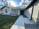 Well-maintained home featuring a walkway to the front door, manicured lawn and tasteful landscaping at 2510 Lakefront Dr, Lake Wales, FL 33898