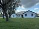Traditional single-story home featuring a spacious lawn and well-maintained landscaping at 2510 Lakefront Dr, Lake Wales, FL 33898