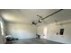 Spacious garage with high ceilings, ceiling fan and ample room for storage at 2510 Lakefront Dr, Lake Wales, FL 33898