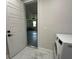 Modern laundry room with tiled floor, washer, and dryer at 2510 Lakefront Dr, Lake Wales, FL 33898