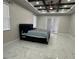 Comfortable main bedroom with a ceiling fan and elegant tile flooring at 2510 Lakefront Dr, Lake Wales, FL 33898