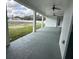 Covered patio with ceiling fans, columns and a view of the spacious backyard at 2510 Lakefront Dr, Lake Wales, FL 33898