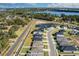 Aerial perspective of a community featuring modern homes, ponds, and thoughtfully planned street layouts at 264 Spirit Landings Cir, Winter Haven, FL 33880