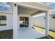 Covered patio and backyard with white vinyl fencing at 264 Spirit Landings Cir, Winter Haven, FL 33880