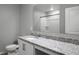 Clean bathroom featuring a granite countertop and a walk-in shower at 264 Spirit Landings Cir, Winter Haven, FL 33880