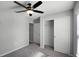 Light-filled bedroom with ceiling fan and sliding closet doors at 264 Spirit Landings Cir, Winter Haven, FL 33880