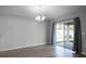 Bright dining room with hardwood floors and sliding glass doors leading to backyard at 264 Spirit Landings Cir, Winter Haven, FL 33880