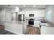 Modern kitchen featuring stainless steel appliances, granite countertops, and a functional island at 264 Spirit Landings Cir, Winter Haven, FL 33880