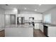 Bright kitchen boasts granite countertops, stainless steel appliances, and white cabinetry at 264 Spirit Landings Cir, Winter Haven, FL 33880