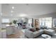 Bright living area with an open floor plan features contemporary furnishings and lots of natural light at 264 Spirit Landings Cir, Winter Haven, FL 33880