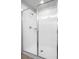 Modern shower featuring a glass enclosure and white tiled walls at 264 Spirit Landings Cir, Winter Haven, FL 33880
