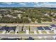 A well-planned community with neatly arranged homes along a quiet street, surrounded by mature trees at 264 Spirit Landings Cir, Winter Haven, FL 33880